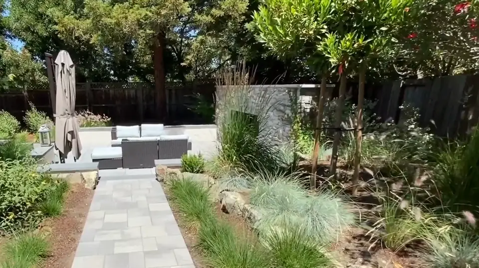 Back patio with pavers and planted borders